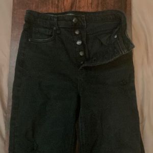 Black, ripped, straight legged jeans